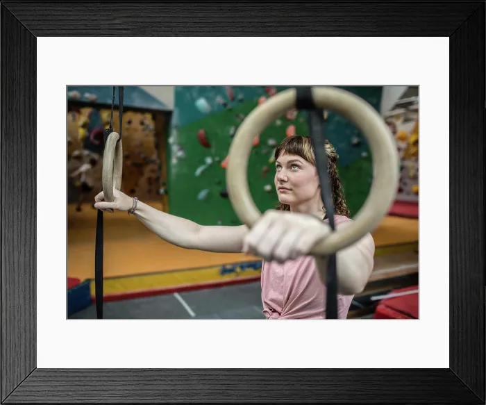 Framed Print : Determined young woman at gymnastics rings Framed Print : Determined young woman at gymnastics rings