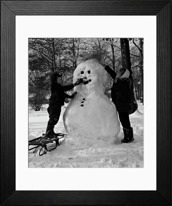 Framed Print : Two boys making snowman Framed Print : Two boys making snowman