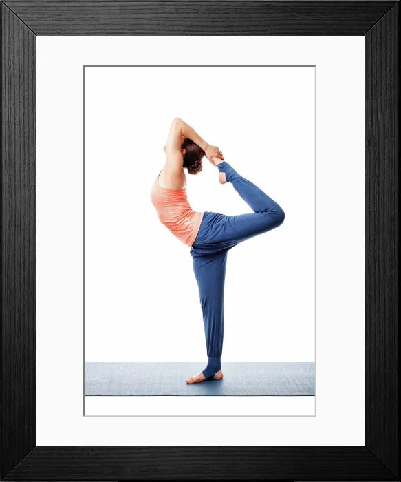 Framed Print : Beautiful sporty fit woman doing yoga asana Natarajasana - Lord of the dance pose advanced variation isolated on white