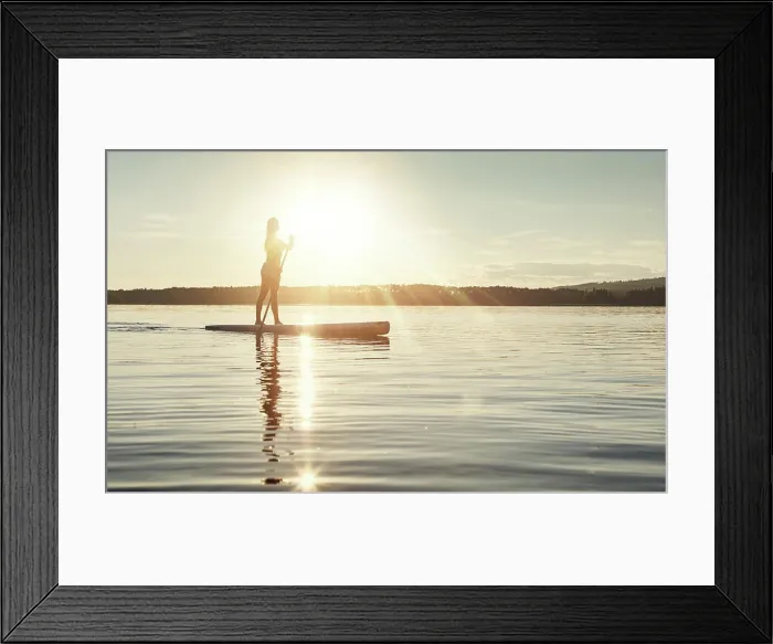 Framed Print : Lake, sunset and woman on paddle board to relax Framed Print : Lake, sunset and woman on paddle board to relax