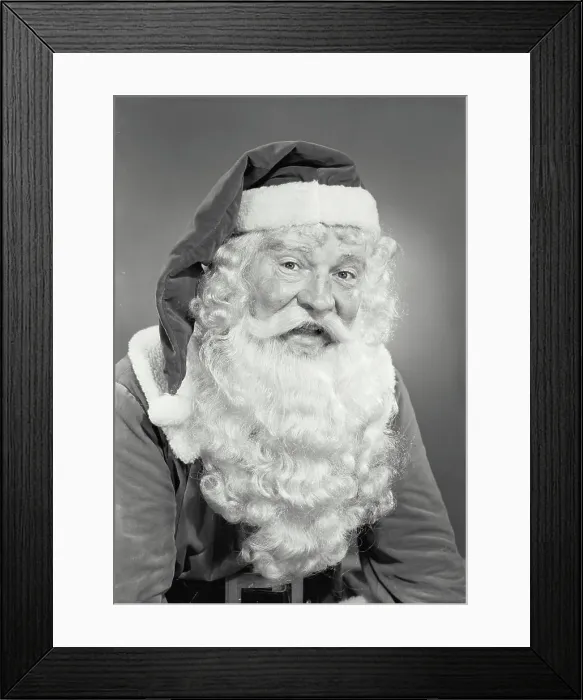 Framed Print : Vintage photograph. Man in Santa Claus costume smiling