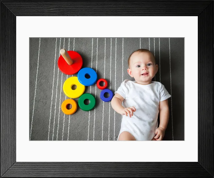 Framed Print : upper view of the little baby girl lying near the multicolored pyramid upper view of the little baby girl lying near Framed Print : upper view of the little baby girl lying near the multicolored pyramid upper view of the little baby girl lying near