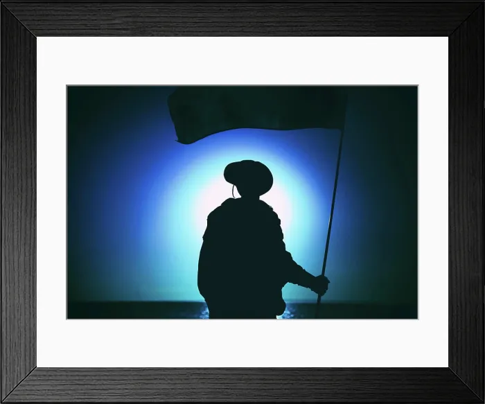 Framed Print : Silhouette of a soldier waving flag against a sunset sky Framed Print : Silhouette of a soldier waving flag against a sunset sky