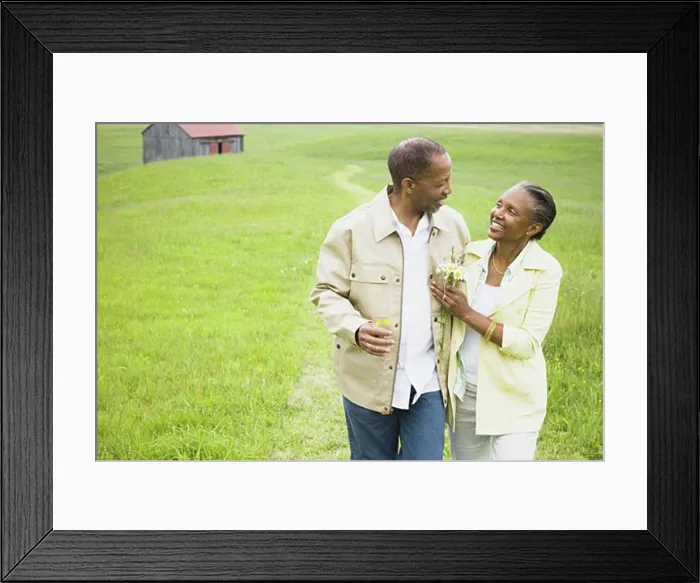 Framed Print : Senior man and a senior woman looking at each other
