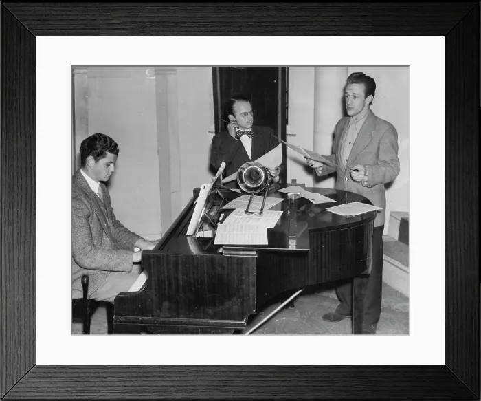 Framed Print : Billy Weston looks pensive and pulls one ear as he listens to Norman Pearson sing a new number Framed Print : Billy Weston looks pensive and pulls one ear as he listens to Norman Pearson sing a new number