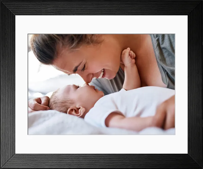 Framed Print : Mom, baby and happy on bed in home for support Framed Print : Mom, baby and happy on bed in home for support