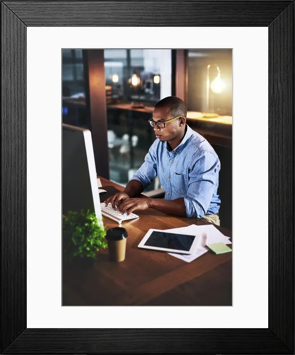 Framed Print : African, businessman and typing on tech at night in research as corporate communication specialist Framed Print : African, businessman and typing on tech at night in research as corporate communication specialist