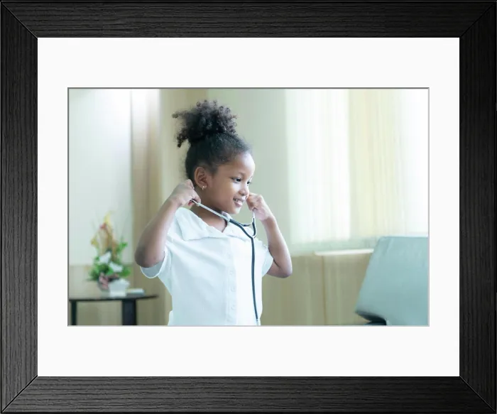 Framed Print : A little girl. with a big dream of growing up to be a doctor A little girl Framed Print : A little girl. with a big dream of growing up to be a doctor A little girl