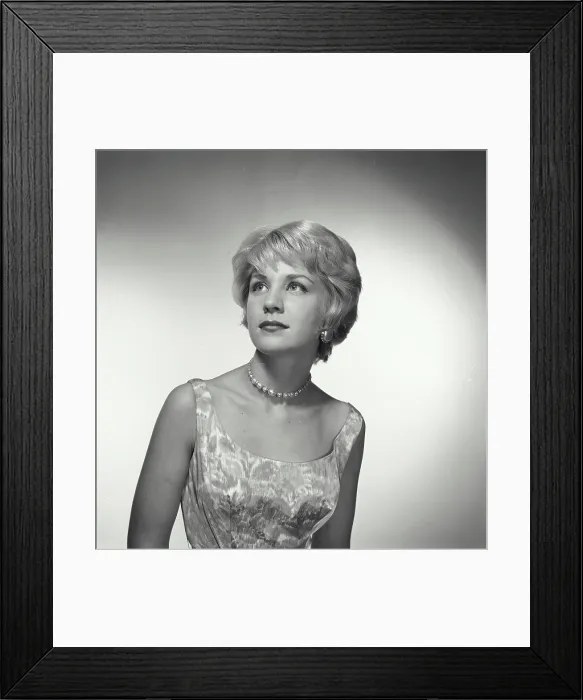 Framed Print : Vintage Photograph. Woman looks up and to the left of frame in studio portrait Framed Print : Vintage Photograph. Woman looks up and to the left of frame in studio portrait
