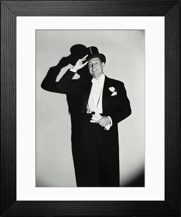 Framed Print : Vintage Photograph. Smiling man wearing tuxedo putting on top hat