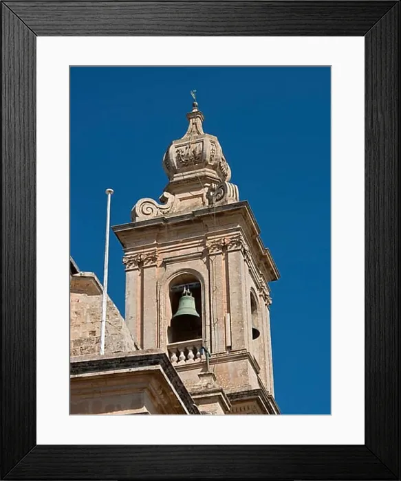 Framed Print : Detailed view of a baroque bell tower with decoration and blue sky in the background Framed Print : Detailed view of a baroque bell tower with decoration and blue sky in the background