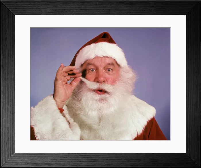 Framed Print : 1960s PORTRAIT SANTA CLAUS TWIRLING THE END OF HIS MUSTACHE LOOKING AT CAMERA