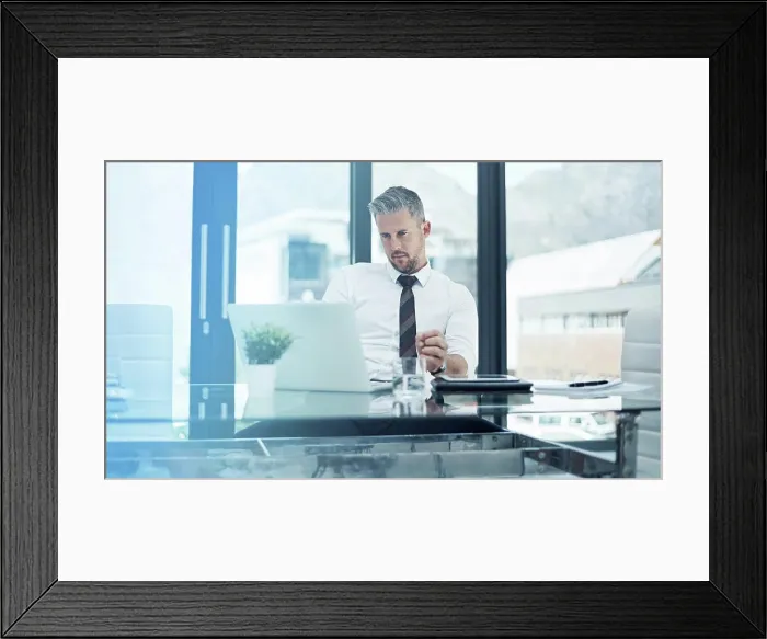 Framed Print : Serious, business man and laptop in office for company investment Framed Print : Serious, business man and laptop in office for company investment