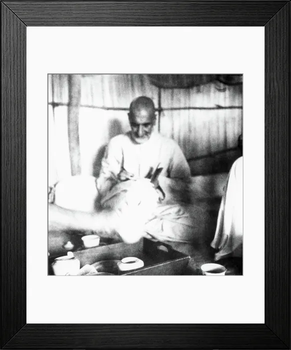 Framed Print : Khan Abdul Gaffar Khan, sitting in a hut and writing during his visit of the riot stricken areas of Bihar