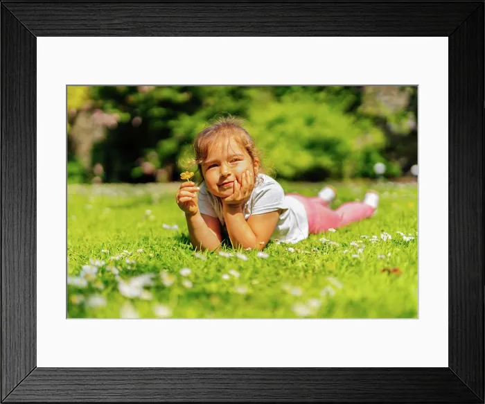 Framed Print : Young girl holding yellow Buttercup flower on meadow Young Caucasian white girl holding yellow Buttercup flower Framed Print : Young girl holding yellow Buttercup flower on meadow Young Caucasian white girl holding yellow Buttercup flower