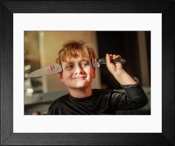 Framed Print : boy in halloween zombie costume and face makeup Framed Print : boy in halloween zombie costume and face makeup