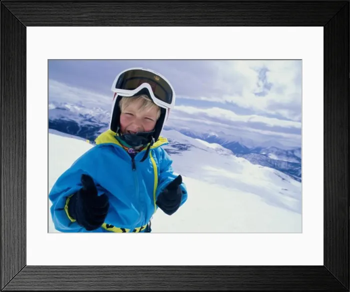 Framed Print : Portrait of a boy showing a thumbs up sign, Banff National Park, Alberta, Canada