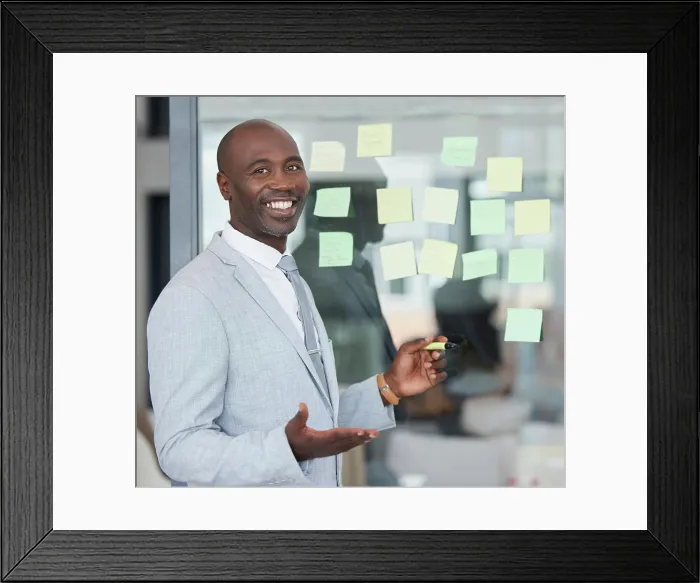 Framed Print : Black man, working portrait and board writing for corporate law schedule with happiness Framed Print : Black man, working portrait and board writing for corporate law schedule with happiness