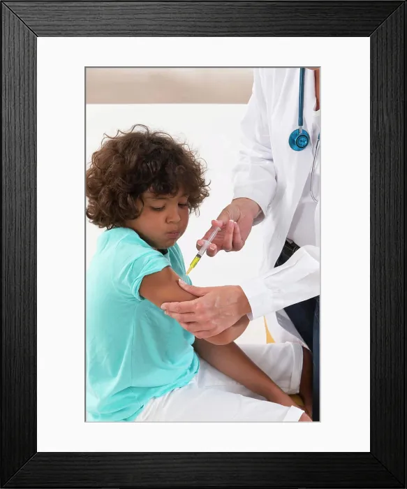 Framed Print : Vaccinating a boy