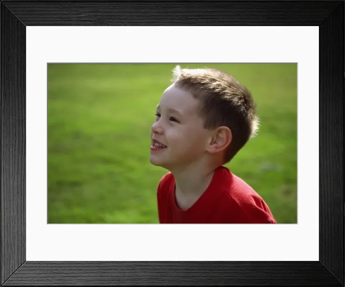 Framed Print : Side profile of a boy smiling Framed Print : Side profile of a boy smiling