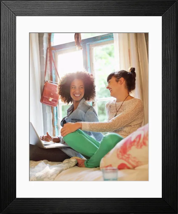 Framed Print : Women relaxing together in bedroom Framed Print : Women relaxing together in bedroom