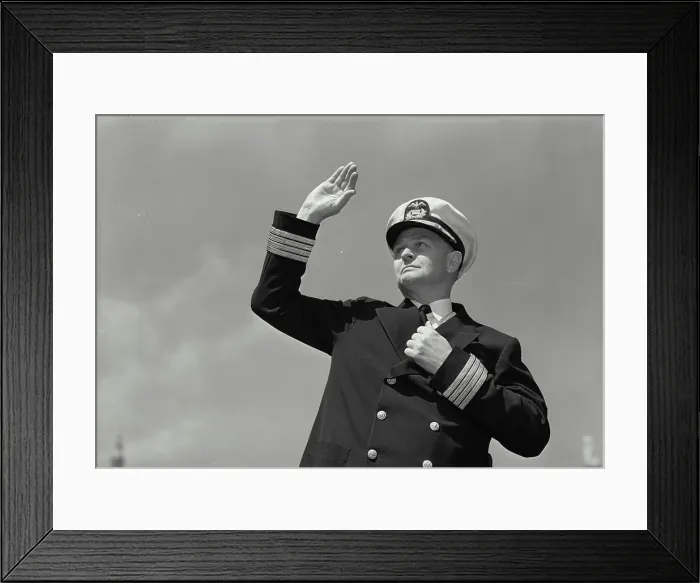 Framed Print : Vintage Photograph. Man in captains uniform making hand signal Framed Print : Vintage Photograph. Man in captains uniform making hand signal