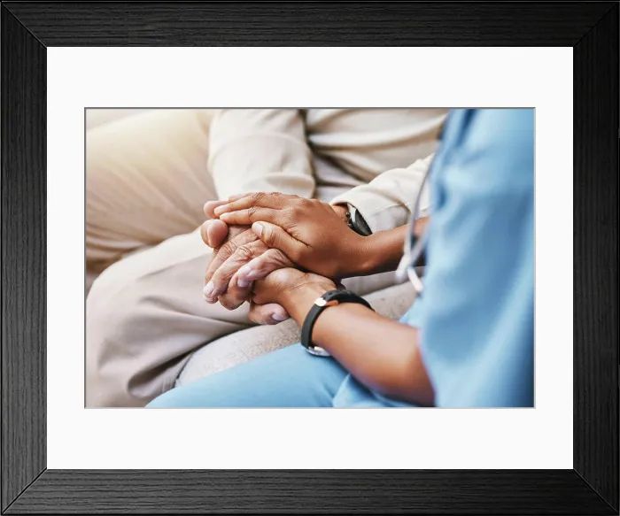Framed Print : Nurse holding hands with patient in empathy Framed Print : Nurse holding hands with patient in empathy