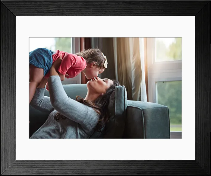 Framed Print : Relax, happy and kiss with mother and baby on sofa for bonding