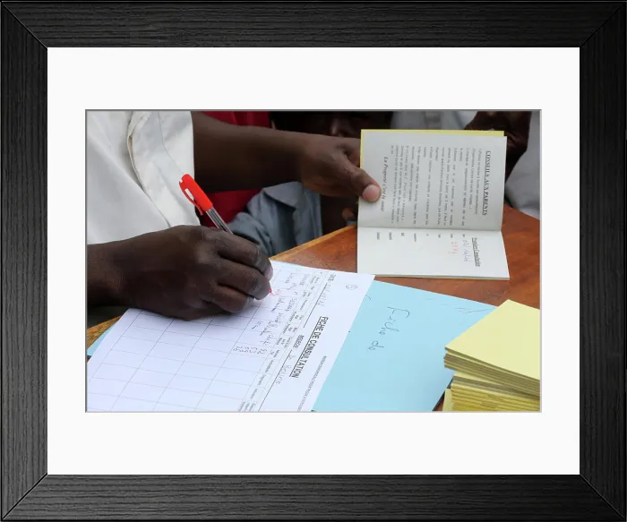 Framed Print : African paediatric hospital. Health. Child health record booklet. Togo