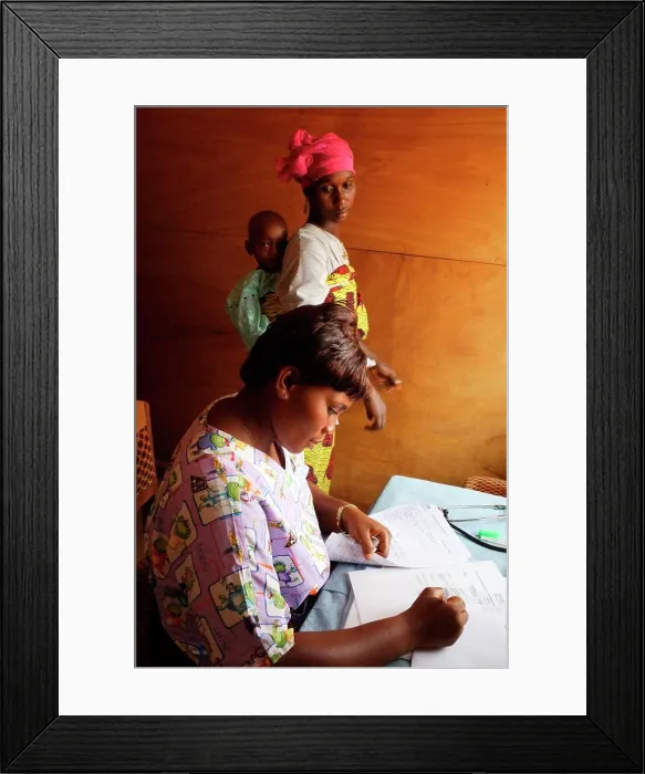 Framed Print : Mother and her child suffering from malnutrition in medical consultation