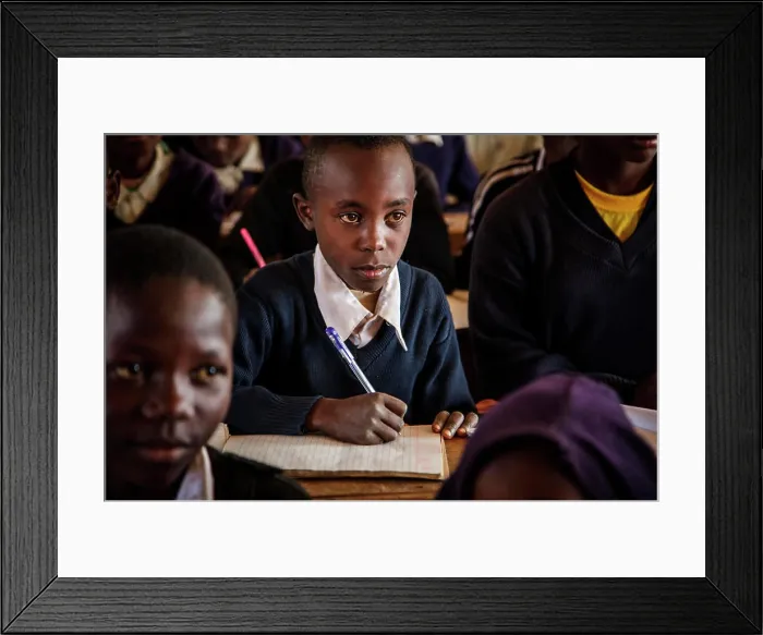 Framed Print : Tanzanian student sitting at desk in school Framed Print : Tanzanian student sitting at desk in school