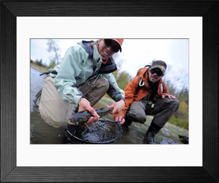 Framed Print : Man and woman kneeling in water to show off a Dolly Varden char caught in Deep Creek Framed Print : Man and woman kneeling in water to show off a Dolly Varden char caught in Deep Creek