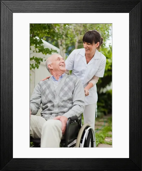 Framed Print : Nurse wheeling older patient outdoors Framed Print : Nurse wheeling older patient outdoors