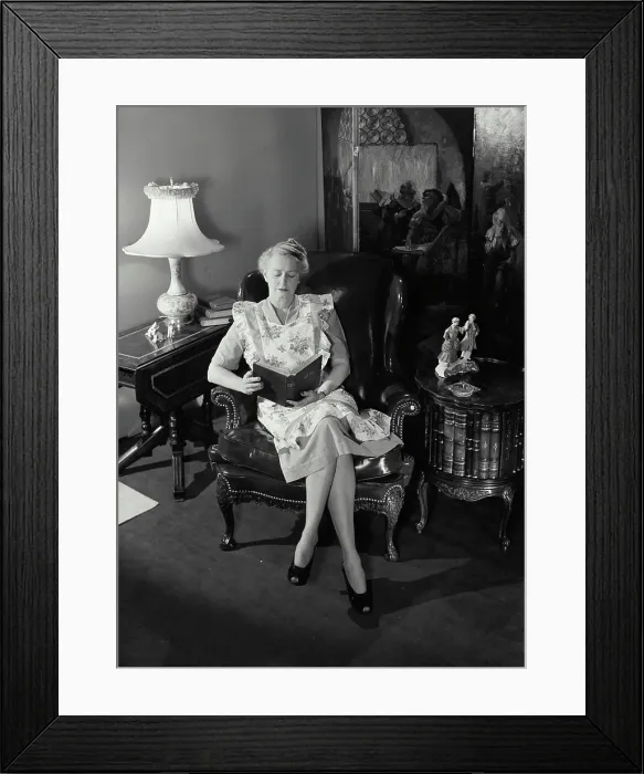 Framed Print : Vintage Photograph. Senior woman sitting in chair reading the Holy Bible