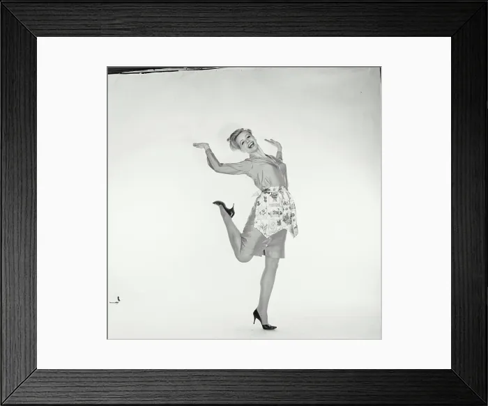 Framed Print : Portrait of a young woman standing on one leg