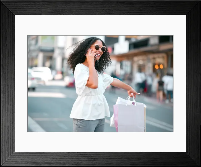 Framed Print : Taxi request, shopping bags and woman with phone call in the city standing in the street