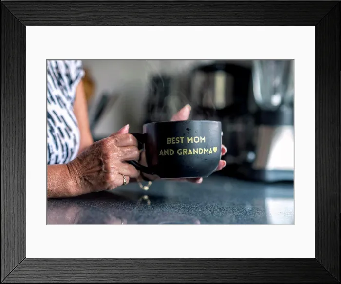 Framed Print : A latin grandma holding a black mug with a frase Framed Print : A latin grandma holding a black mug with a frase