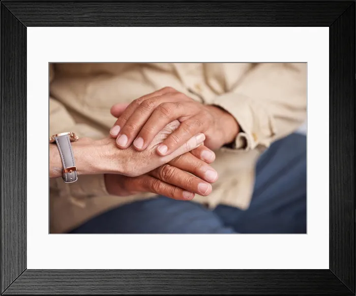 Framed Print : Senior couple holding hands for support
