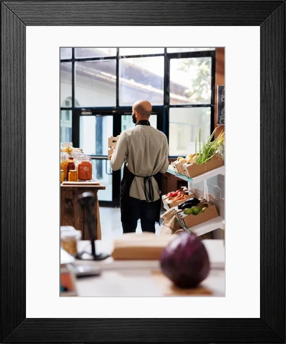 Framed Print : Arab male storekeeper holding two boxes filled with various fruits and vegetables Framed Print : Arab male storekeeper holding two boxes filled with various fruits and vegetables