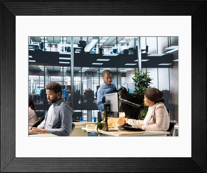 Framed Print : Corporate woman employee receiving a food delivery at her desk Framed Print : Corporate woman employee receiving a food delivery at her desk