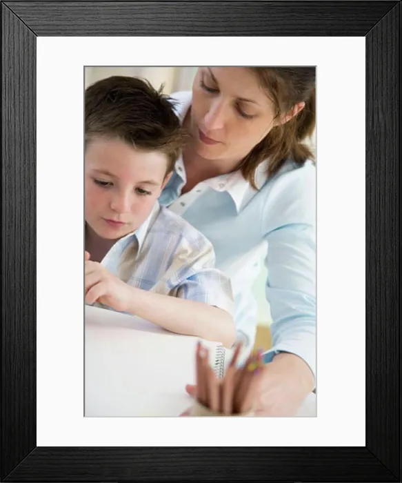 Framed Print : Close-up of a young woman teaching her son to draw Framed Print : Close-up of a young woman teaching her son to draw
