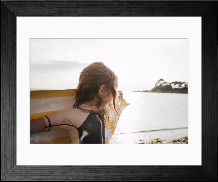 Framed Print : girl running with towel at the beach watching the sunset Framed Print : girl running with towel at the beach watching the sunset