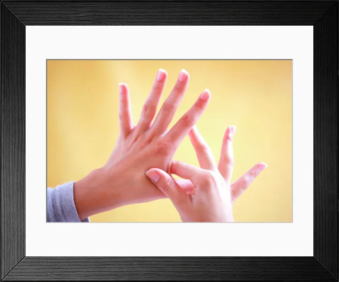 Framed Print : Woman massaging her hands