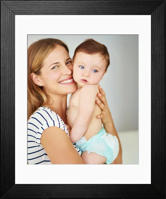 Framed Print : Smile, portrait and mother holding baby in diaper at home for safety Framed Print : Smile, portrait and mother holding baby in diaper at home for safety