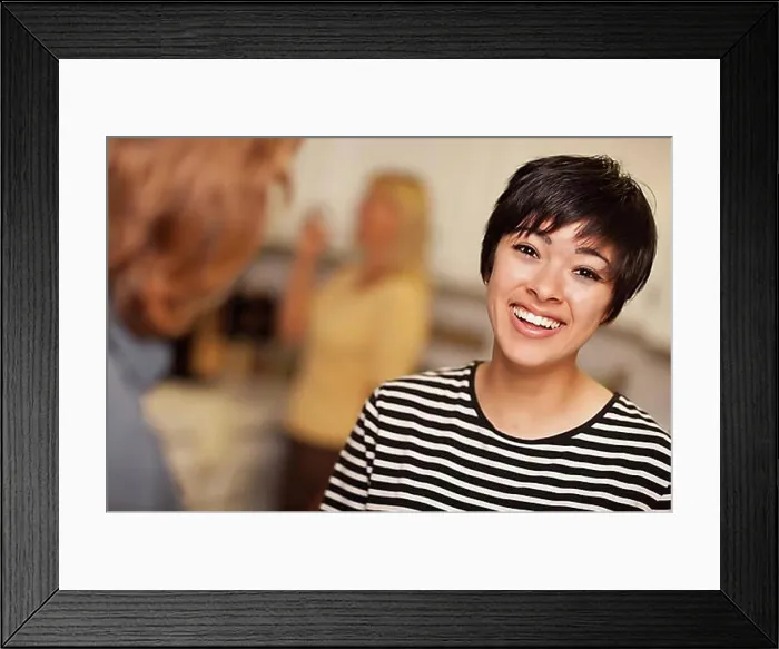 Framed Print : Laughing young woman socializing in a party setting Framed Print : Laughing young woman socializing in a party setting