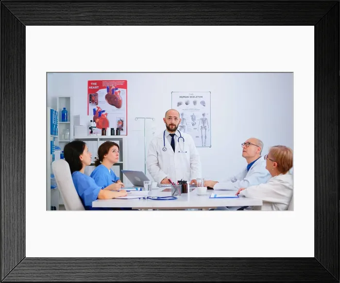 Framed Print : Young specialist doctor explaining diagnosis for patients treatment issues record Framed Print : Young specialist doctor explaining diagnosis for patients treatment issues record