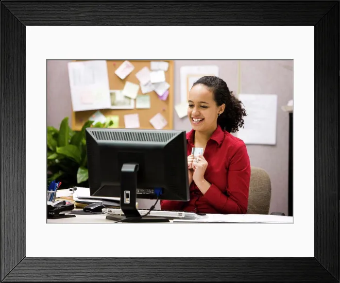 Framed Print : woman making an online purchase Framed Print : woman making an online purchase