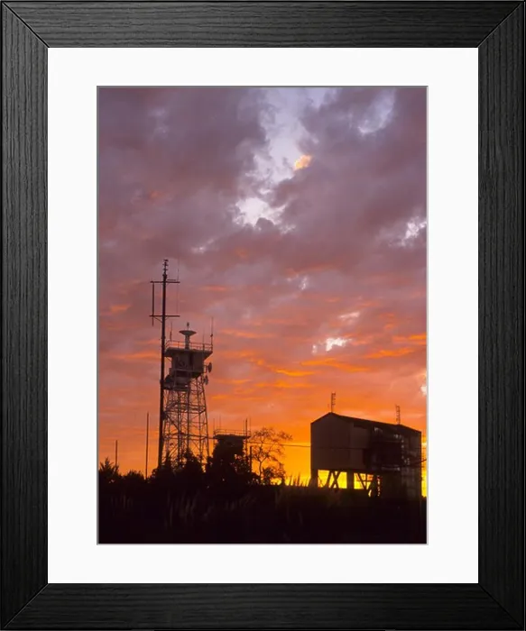 Framed Print : Silhoulette of communication towers against an orange sunset Framed Print : Silhoulette of communication towers against an orange sunset