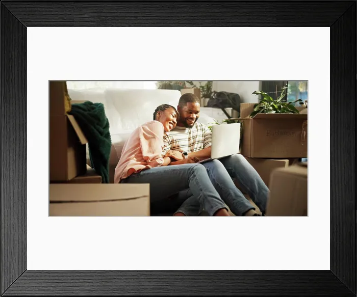 Framed Print : Happy, couple and browsing on laptop in new home Framed Print : Happy, couple and browsing on laptop in new home