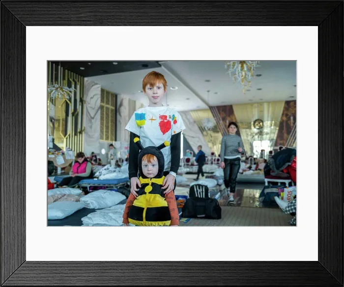 Framed Print : Ukranian refugees at a temporary shelter created inside the big ballroom Framed Print : Ukranian refugees at a temporary shelter created inside the big ballroom
